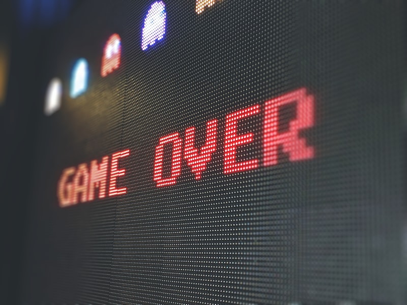 Restored retro arcade cabinets glowing in a dark room
